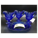 GROUP INCLUDING THREE COBALT BLUE COLOR CREAMERS A