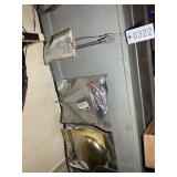 CONTENTS HANGING ON WALL ABOVE CUT THROUGH AUTOMOT