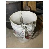 BUCKET CONTAINING SNOW CHAINS FOR 15-IN TIRES