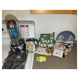 GROUP OF DECORATIVE ITEMS RIGHT OF STOVE LIGHT UP