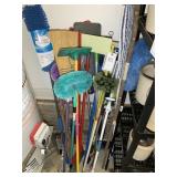 LARGE GROUP OF BROOMS, MOPS, DUSTERS, HANDLES, ETC