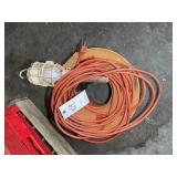 GROUP INCLUDING EXTENSION CORD ON REEL AND WORK LI