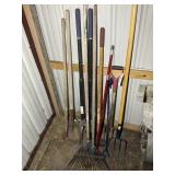 GROUP OF YARD TOOLS RAKES SHOVEL PITCHFORKS POST H