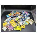 GROUP OF POKEMON CARDS, APPEAR TO HAVE BEEN WET