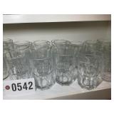 SHELF OF ASSORTED  DRINKING GLASSES