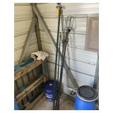 GROUP OF GREEN T POSTS AND TIKI TORCH HOLDERS