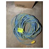 BLUE EXTENSION CORD, HAS BEEN REPAIRED IN ONE SPOT
