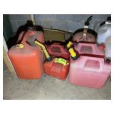 GROUP OF GAS CANS AND EMPTY JUGS