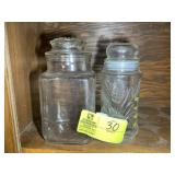 PAIR OF GLASS CANISTERS, ONE MR PEANUT