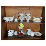 TWO SHELVES OF ASSORTED DECORATIVE VASES, PLATES,