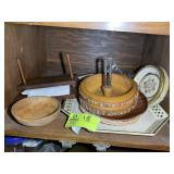 TOP SHELF OF LOWER CABINET LEFT OF OVEN, NUT CRACK