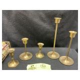 GROUP INCLUDING BRASS COLORED CANDLE STICK HOLDERS
