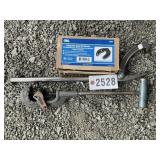 GROUP INCLUDING A LARGE PIPE CUTTER, ADJUSTABLE GL