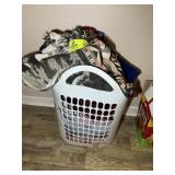 PLASTIC BASKET WITH MISC BLANKETS AND THROWS