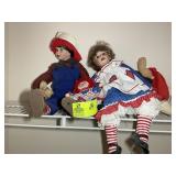 GROUP OF DOLLS ON TOP SHELF OF MASTER CLOSET