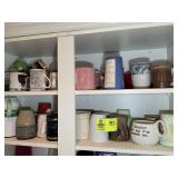 TOP TWO SHELVES OF CABINET, MISC COFFEE MUGS