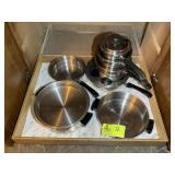 GROUP OF STAINLESS STEEL HOPEWARE POTS AND PANS,