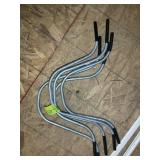 GROUP OF METAL HANDLE BAR TYPE BARS, LOCATED IN TH