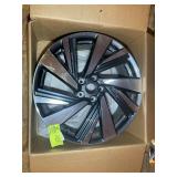 20 IN NISSAN WHEEL, SOME DAMAGE, LOCATED IN THE AT