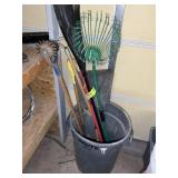 TRASH CAN WITH YARD TOOLS, POLE SAW, RAKE SHOVEL