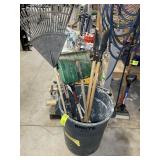 TRASH CAN WITH YARD TOOLS, POST HOLE DIGGER, RAKE