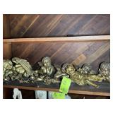 TOP SHELF OF DECORATIVE CHERUBS