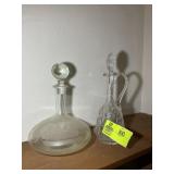 PAIR OF GLASS DECANTERS, 12 IN AND 14 IN TALL