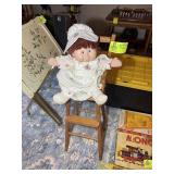 CABBAGE PATCH DOLL IN WOODEN HIGH CHAIR