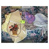 GROUP OF APRONS AND BONNETS