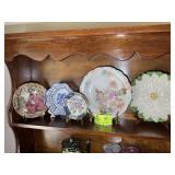 GROUP OF DECORATIVE PLATES ON PLATE STANDS