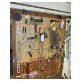 CONTENTS OF PEGBOARD INCLUDING, LEVEL, SAW, DRILL