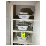 CABINET WITH CORNING WARE BAKING DISHES AND MISC C
