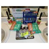 GROUP INCLUDING TOOTH BRUSHES, PLACKERS, POO-POURR