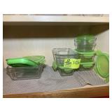 SHELF WITH GLASS STORAGE CONTAINERS, GREEN LIDS