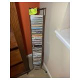 METAL CD RACK WITH MISC CDS VARIOUS TITLES AND AUT