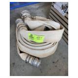 PAIR OF USED 2 IN WATER HOSES, ONE HAS HOLE