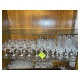 SHELF WITH CLEAR GLASS STEMMED GLASSWARE