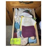 DRAWER WITH ASSORTED DISH RAGS AND HOT MITS