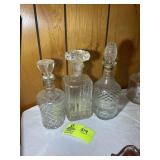 GROUP OF CLEAR GLASS DECANTERS, 9 IN TO 11 IN TALL