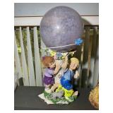 YARD ART WITH BOY AND GIRL BASE AND GAZING BALL ON