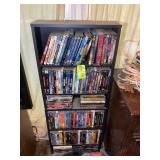 SHELF WITH ASSORTED BLU-RAY DISCS AND DVDS 19.5' X