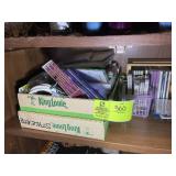 SHELF WITH MISCELLANEOUS CASSETTE TAPES AND CDS VA