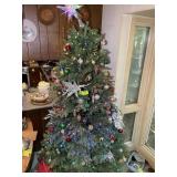 PRE-LIT CHRISTMAS TREE WITH ORNAMENTS APPEARS TO B