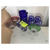 GROUP OF COLORED GLASS STEMWARE AND PITCHER 12 IN