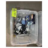TOTE WITH ASSORTED CORDS, BATTERY CHARGER, ETC