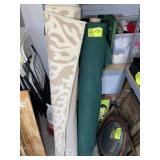 LARGE ROLL OF GREEN FABRIC AND AREA RUG