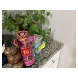 3 WINE BOTTLES AND PLANT