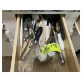 3 DRAWER OF KITCHEN UTENSILS LEFT OF STOVE