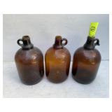 GROUP OF THREE 1 GALLON BROWN GLASS JUGS