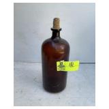 LARGE BROWN GLASS BOTTLE APPROXIMATELY 13 IN TALL